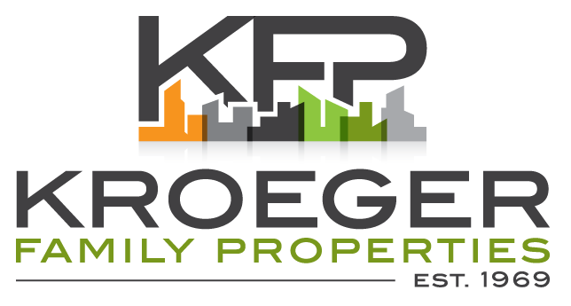 the logo for kroeger family properties with a city skyline